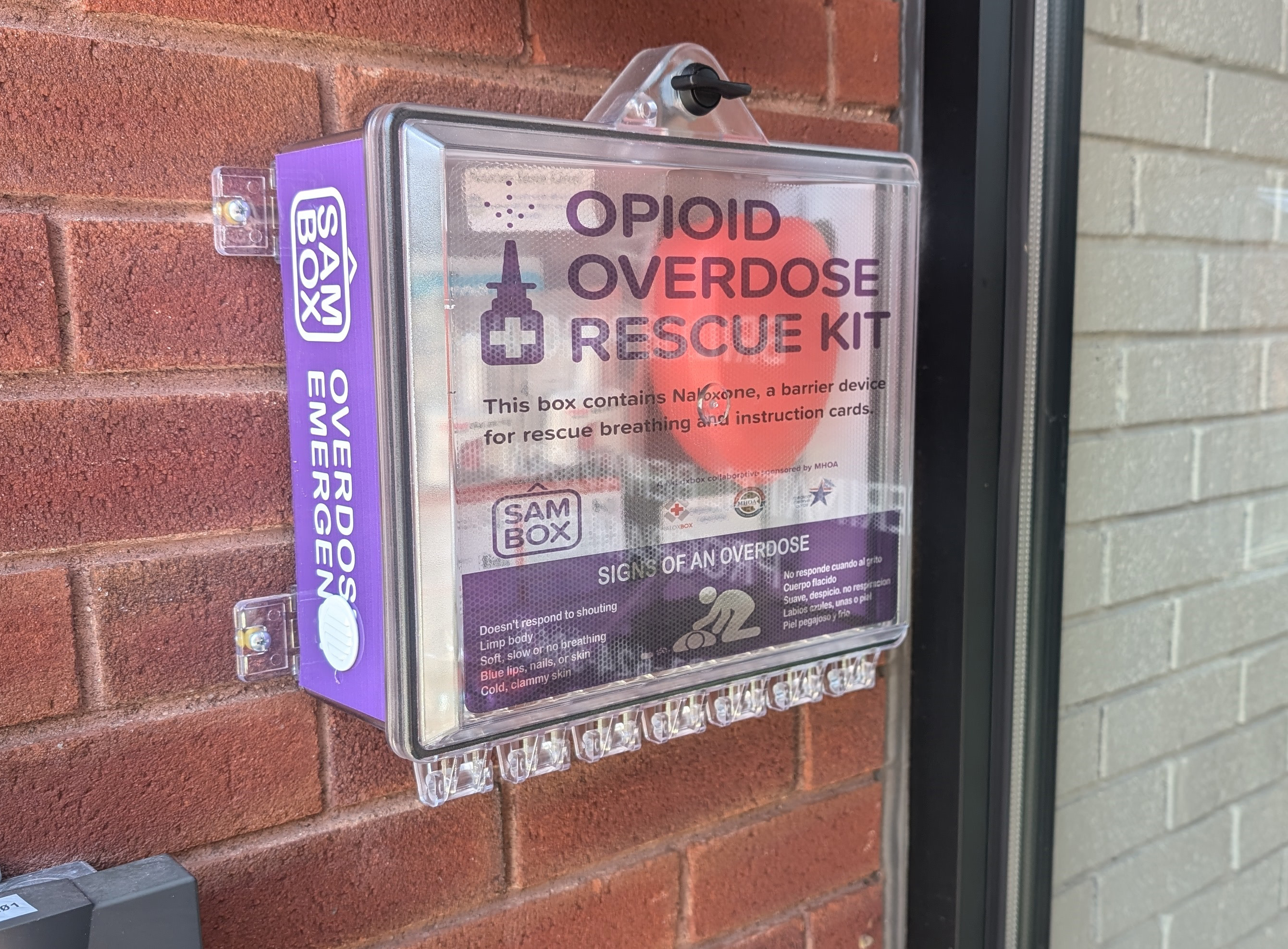 Photo of a SAMBOX Opioid Overdose Rescue kit mounted on the wall of the Grayken Center for Treatment at South Shore Health