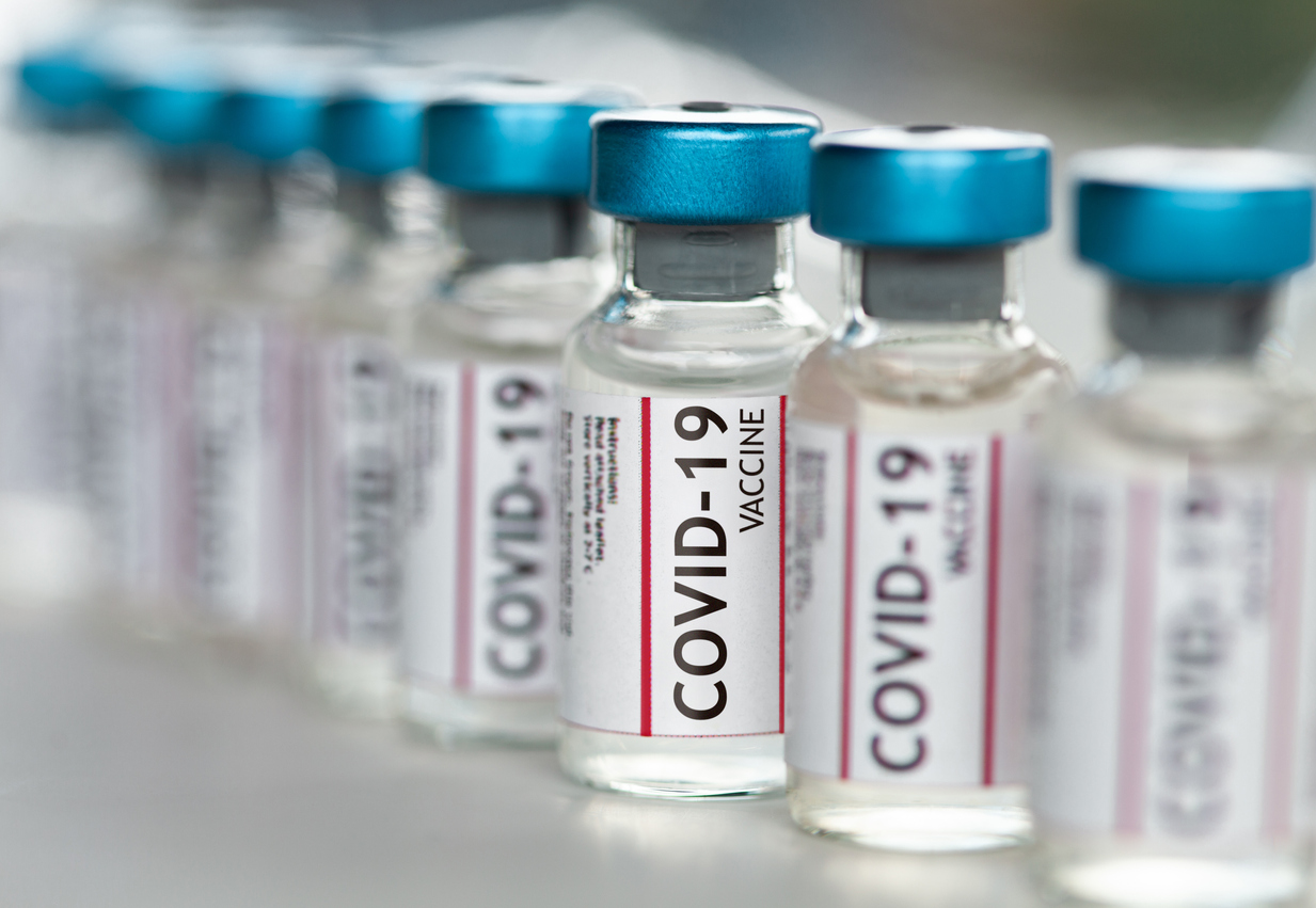 A photo of several vials of COVID-19 vaccine
