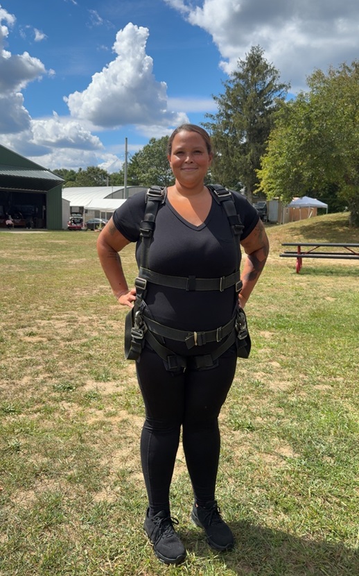 A woman geared up to go skydiving