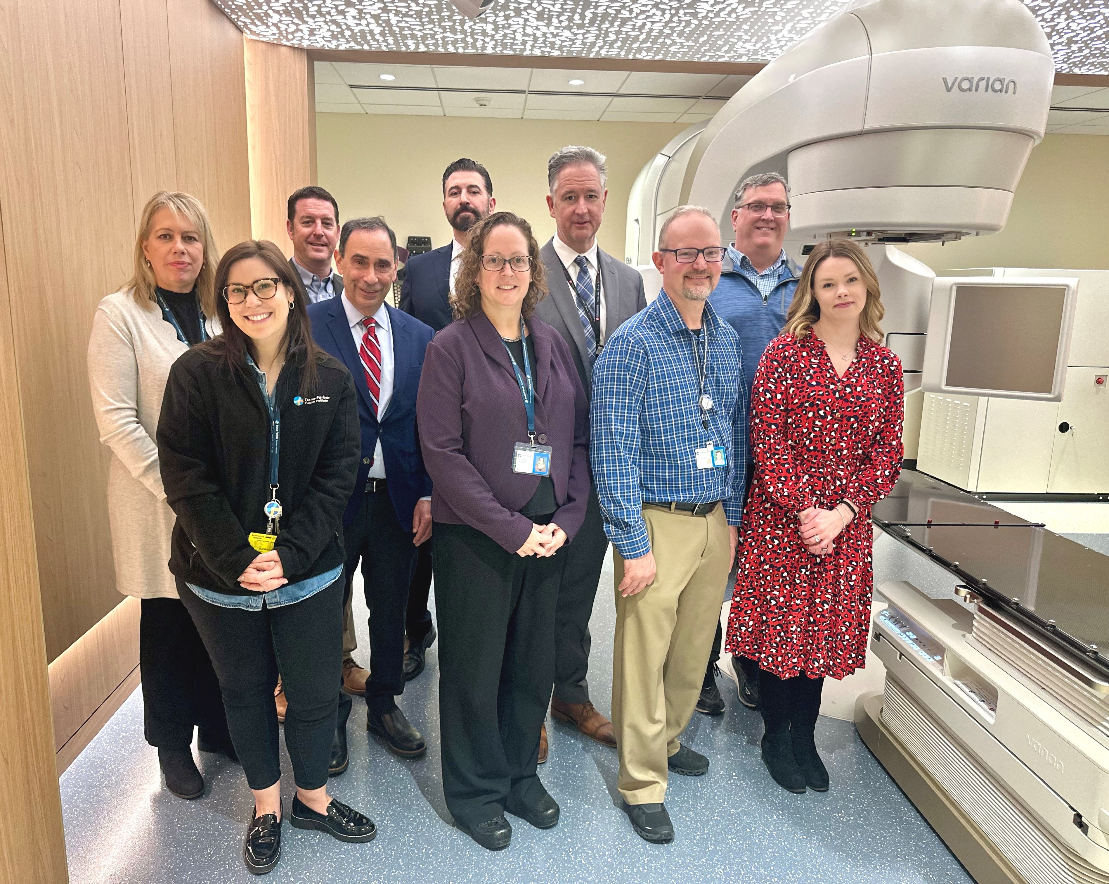 Colleagues from the Dana-Farber Brigham Cancer Center at South Shore Health pose next to the new Varian TrueBeam Linear Accelerator machine