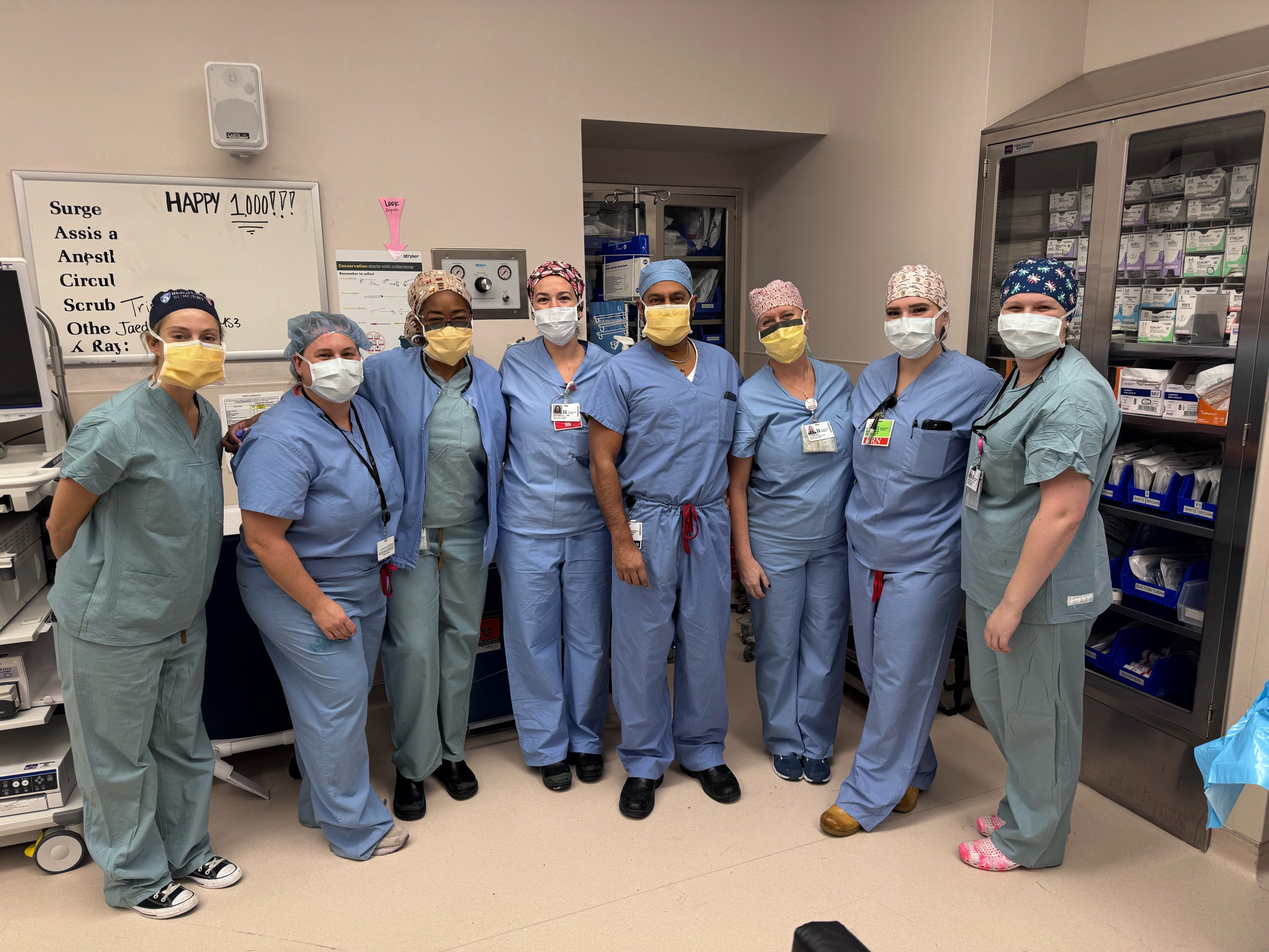 Neil Ghushe and members of his surgical team pose for a photo prior to his 1,000th bariatric surgery at South Shore Hospital.