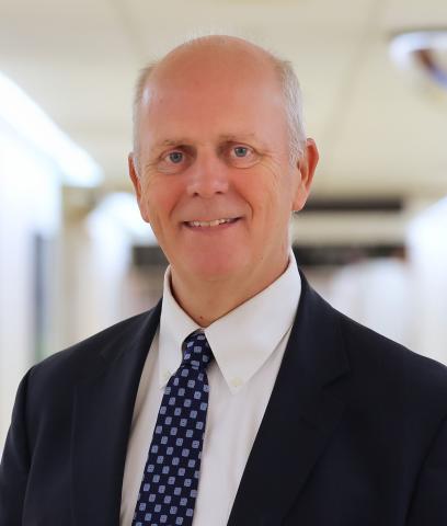 Professional headshot of Gordon Huggins, MD of South Shore Health