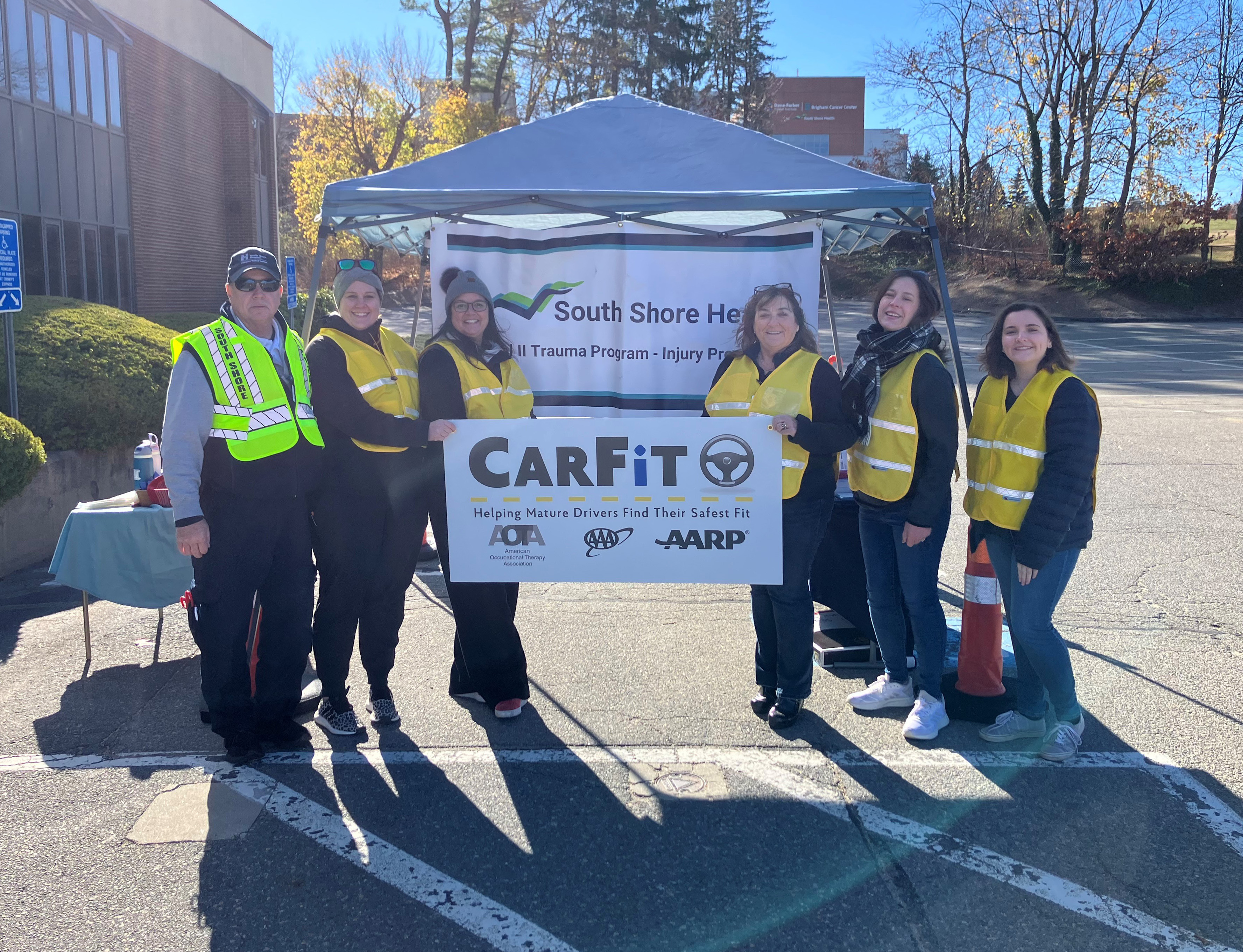 South Shore Health colleagues pose for a group photo during their November CarFit event.