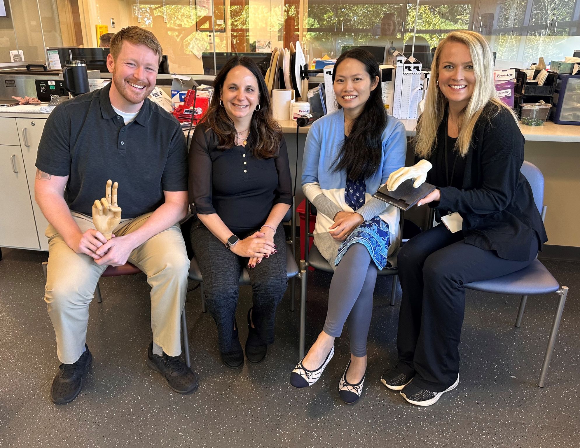 Four certified hand therapists from South Shore Health pose for a group photo.