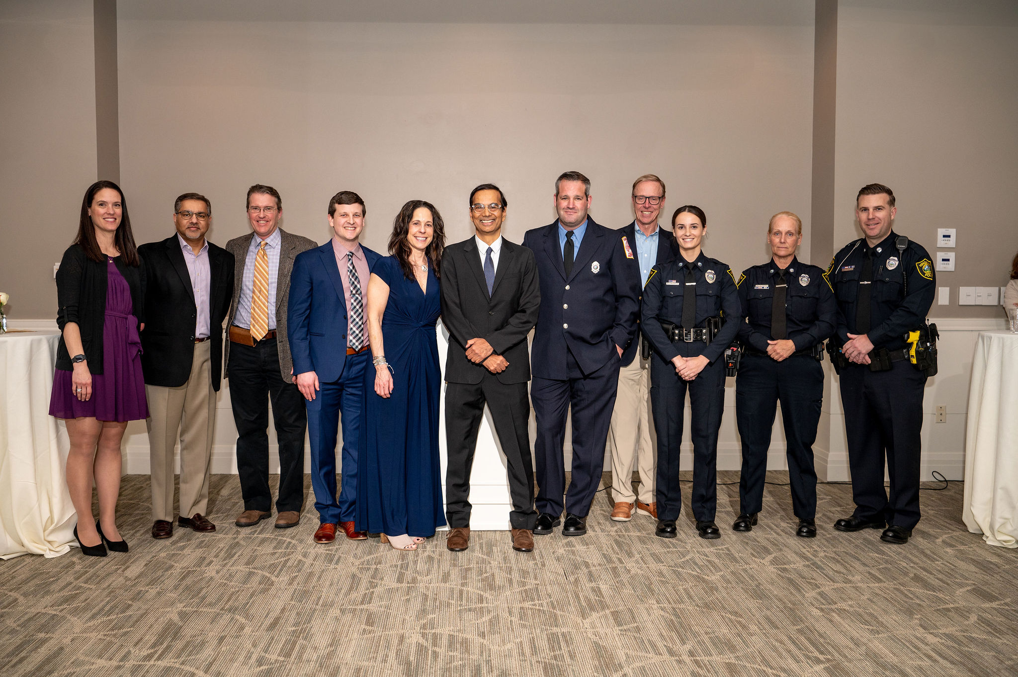 Baba Shetty, center, poses for a photo with the South Shore Health colleagues and community first responders who cared for him.