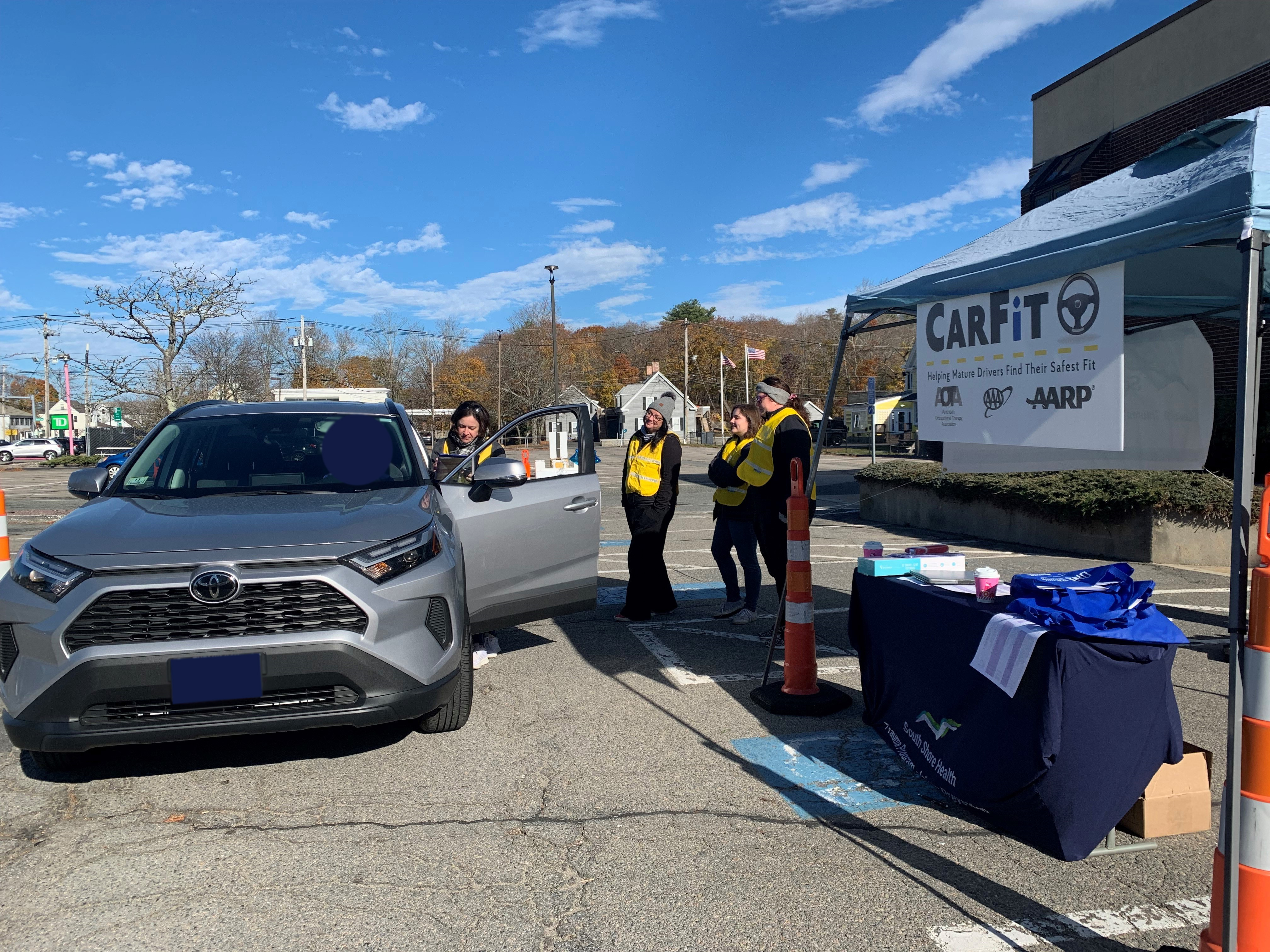 South Shore Health team conducting a CarFit check in Weymouth.