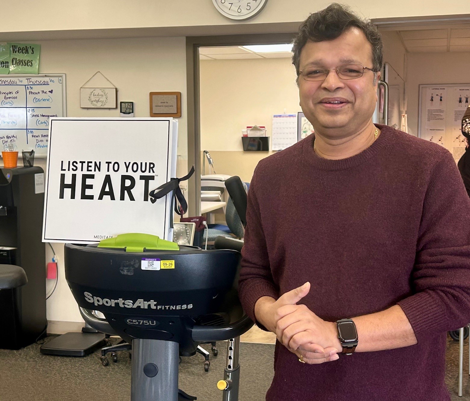 Cardiac rehab patient Sanjay Padhi stands by a treadmill