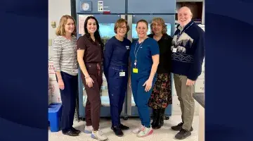 Six colleagues from South Shore Health's blood bank pose for a photo.