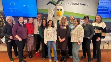 Members of the Generous Hearts committee pose for a photo after the 2024 holiday raffle.