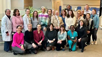 More than a dozen South Shore Medical Center colleagues pose for a group photo.